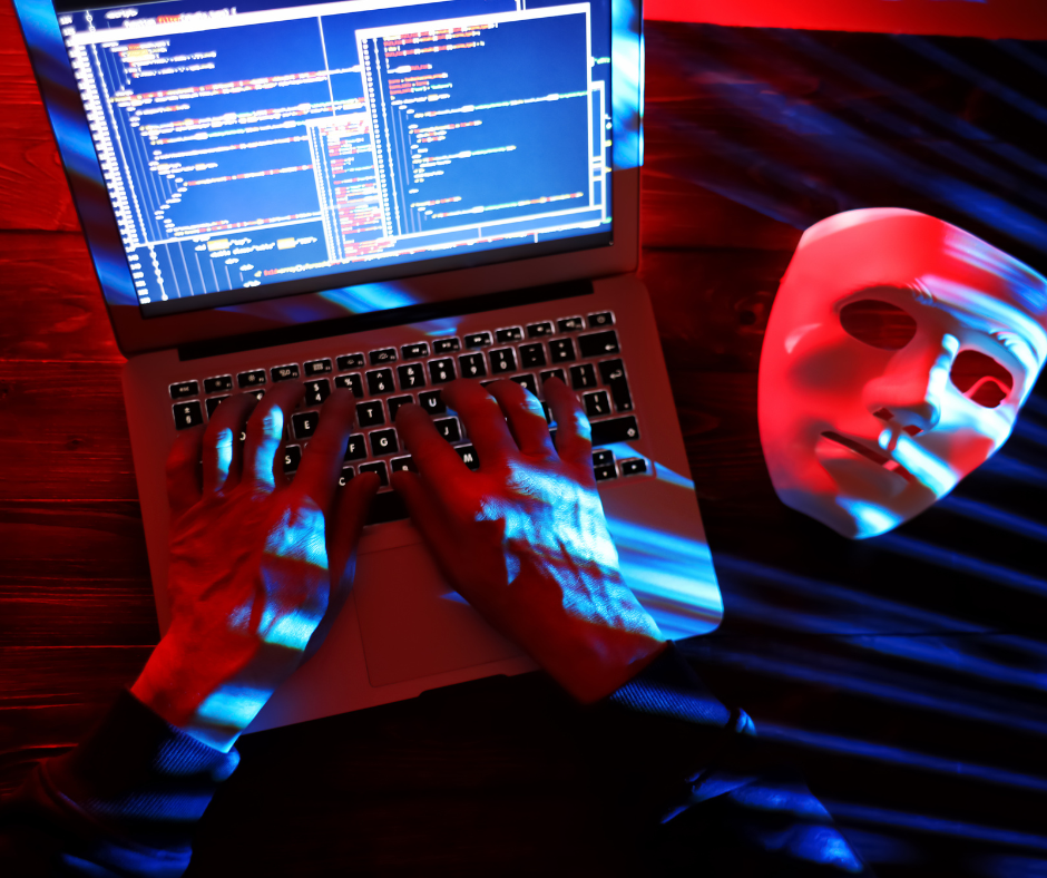 laptop, na ekranie wykresy, obok leży biała maska