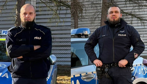 policjanci przy radiowozach