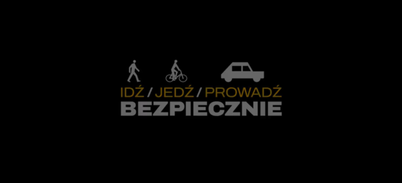 zdjęcie kolorowe z napisem: Idź / jedź / prowadź bezpiecznie